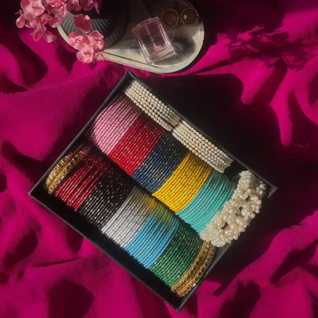 metal bangles set with pearl and kundan design